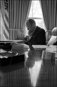 President Ford working in the Oval Office on March 25, 1975.
