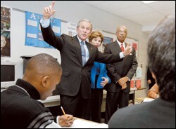 President Bush speaks to a high school class.