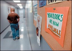 A high school student walks the halls of West Houston Charter School in December after a final exam. The high school portion of the campus closed after the school's operators said there was not enough money to keep it running.