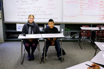 Seventh grader Danny Perez and his assistant principal, Kristy Treewater, sit side-by-side during a student-run session of peer court at Davidson Middle School in San Rafael, Calif.