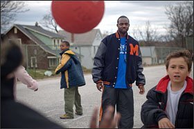 Calvet Liburd, who coordinates the Sports4Kids program at Garrett Heights Elementary School in Baltimore, plays at recess with students last week. Organized activities cut down on mischief, and Mr. Liburd has never sent a child to the office for misbehavior.
