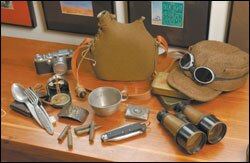 Paul Watkins totes duffel bags filled with wartime relics.