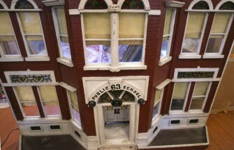 Standing approximately 3-feet-tall, a wooden model of Public School 63 was most likely part of a community diorama.