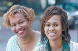 BACK ON TRACK: Rachel Foster, right, a 17-year-old senior at LeFlore Preparatory Academy in Mobile, was referred to Helping Families at the end of 10th grade for skipping school and runnnig away from home. It was a defiant reaction, she says, to her mother's re-emergence after eight years of drug addiction and recovery. Her mother, Reenie Kidd, left, credits the family counseling and close attention from their case officer with keeping Rachel from dropping out.