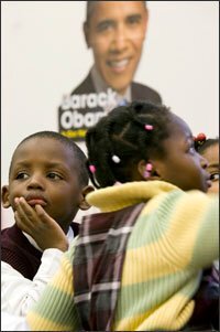 Mamadou Kante, 3, listens as he is read a book during class.