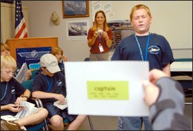 Austin Braley, 12, spells “captain” using the aviation alphabet—with “Charlie” for C and “alpha” for A, and so on—in a game during the Mesa, Ariz., schools’ two-week aviation camp. The Boeing Co. supports the camp with donations and volunteers.