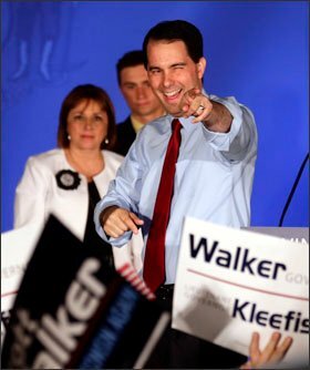 Wisconsin Gov. Scott Walker celebrates at his victory party after defeating Democratic challenger Tom Barrett in a recall election last week. His steps to curb the collective bargaining rights of public employee unions set off a yearlong battle.