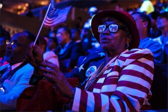 Sylvia Crier, a delegate to the Democratic National Convention from New Orleans, waits for the next speaker on the final night of the Democratic National Convention.