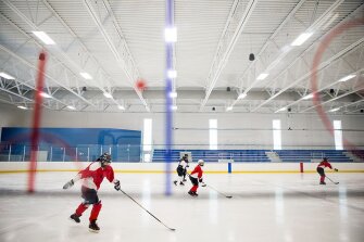 Students and teachers play a game of hockey at the Whitney Rink, a sports center located near the Girls School in Sheridan, Wyo. The Wyoming Girls School rents ice time from the center so students are able to participate in a sport that couldn’t otherwise be done on campus.