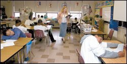 Vanessa Skrat, a language arts and social studies teacher at the Options Complex at the Margaret A. Ireland School in Cleveland, reads a story to her class.