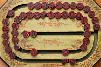 A wooden spelling game, patented in 1886.