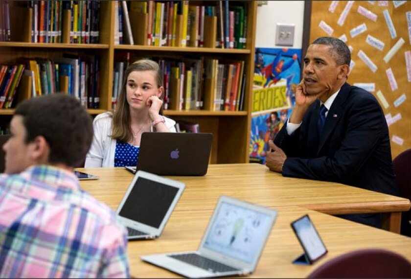 President Barack Obama views a math project during a tour of Mooresville Middle School in Mooresville, N.C., on Thursday.