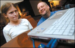Garry M. Gaber, the president of Escape Hatch Entertainment, watches as Sara Rosenberg, 9, of Washington, plays Discover Babylon, a game produced by his Austin, Texas-based company.