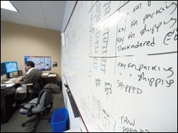 A whiteboard at the Colorado headquarters of Executive Intelligence Inc. shows the shipment status of the software company's data-management products.