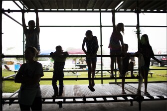 Children play on a scaffold during the fundraiser at the Galveston County Fairgrounds.