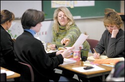 A teacher grades essays.