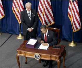 Vice President Joseph R. Biden Jr. stands witness as President Barack Obama signs the economic-stimulus bill on Feb. 17 during a ceremony at the Museum of Nature and Science in Denver.