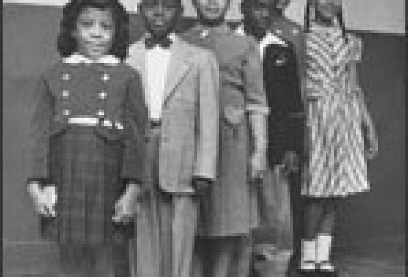 History Makers: Children who were involved in Brown v. Board of Education, which challenged the legality of public school segregation, are shown in Topeka, Kan., in 1953. From left are Vicki Henderson; Donald Henderson; Linda Brown, whose family gave the case its name; James Emanuel; Nancy Todd; and Katherine Carper. The landmark case helped raise courts' role in schools.