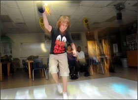 Nate Kaim, 15, uses the SMALLab interactive video-projection program at Coronado High School for an earth science class.