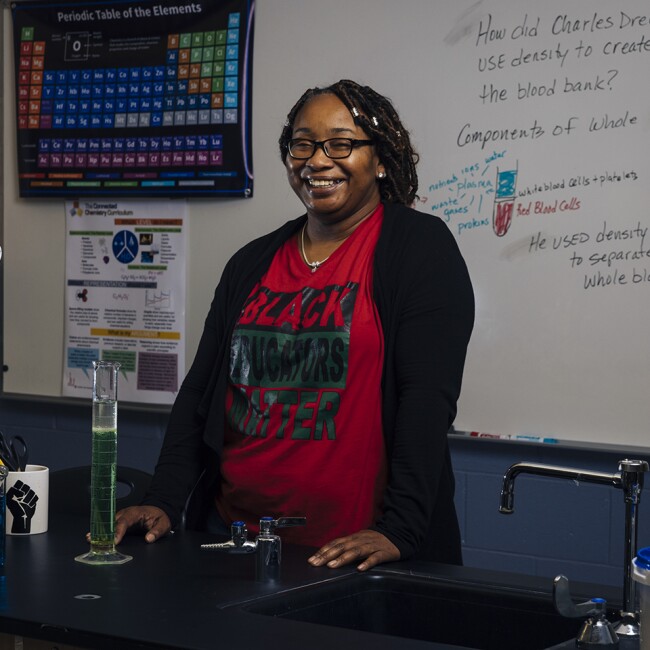 Chemistry teacher Nina Hike poses for a portrait in her classroom at George Westinghouse College Prep on Friday, Nov. 5, 2021 in Chicago, IL. Through her curriculum, Hike highlights scientific discoveries by women and people of color, and also teaches students about environmental racism.