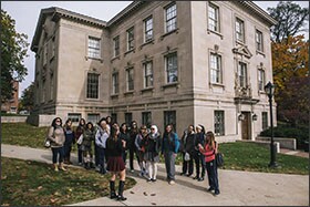 Ayat Husseini, center in blue, tours Lafayette College with classmates.