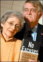 Abigail and Stephan Thernstrom pose with their new book at a Washington meeting.