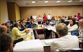 Sam Anderson, left, a retired professor of mathematics and black history, leads a discussion during United Opt Out's national conference this month in Fort Lauderdale, Fla.