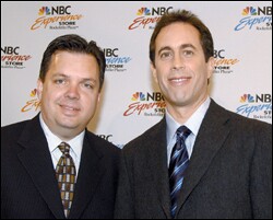 Kevin F. Sullivan, left, with the comedian Jerry Seinfeld last year. The former NBC PR executive is now the assistant secretary for communications and outreach.