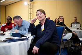 Ruthanne Buck, right, senior advisor to Arne Duncan, listens during a speech at the Teach to Lead summit in Boston. "Now that teach to Lead actually exists, and is something, we've seen more ideas than we ever could have imagined," she said.