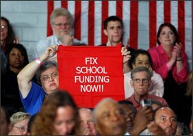 Members of the crowd react to Sen. Barack Obama, D-Ill., during the presidential candidate’s speech on education at Stebbins High School in Riverside, Ohio, last week.