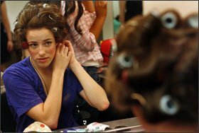 Ann Conway, 17, puts her hair in curlers before a performance last month of “West Side Story” in downtown Chicago through After School Matters.