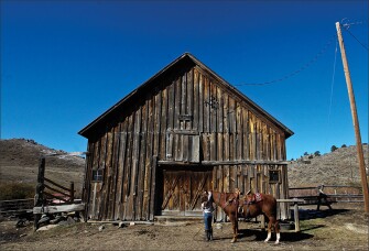 Corinne Gaby prepares to ride her horse, Little Red, on the Notch Peak Ranch in rural Albany County, Wyo. Corinne often rides her horse to school.
