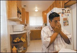 Eddie Mayorquin takes a moment to collect his thoughts as he works with his tutor. The 10th grader says he appreciates the help in mathematics.