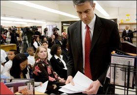 U.S. Secretary of Education Arne Duncan visits a school in Capitol Heights, Md., to announce the first round of economic-stimulus aid for education, $44 billion accompanied by detailed guidelines on its use.