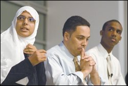 Nageya Omar, left, a student from Egypt, presents her research at a Community Youth Mapping conference in Washington, while Raul Ratcliffe, center, a co-director of the initiative, and Anthony George of New York City, a participant in the program, listen. The goal of the program is to link teenagers with employment and other oppotunities.