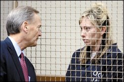 Lawyer Allan Stokke, left, talks to Sarah Bench-Salorio, 28.