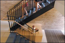 Middle Grades Partnership student Azia Wells reads in the stairwell of the Friends School of Baltimore.
