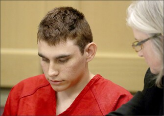 Nikolas Cruz, accused of murdering 17 people in the Florida high school shooting, appears in court for a status hearing in Fort Lauderdale, Fla., on Feb. 19. Cruz was formally charged on March 7 with 17 counts of first-degree murder, which could mean a death sentence if he is convicted.