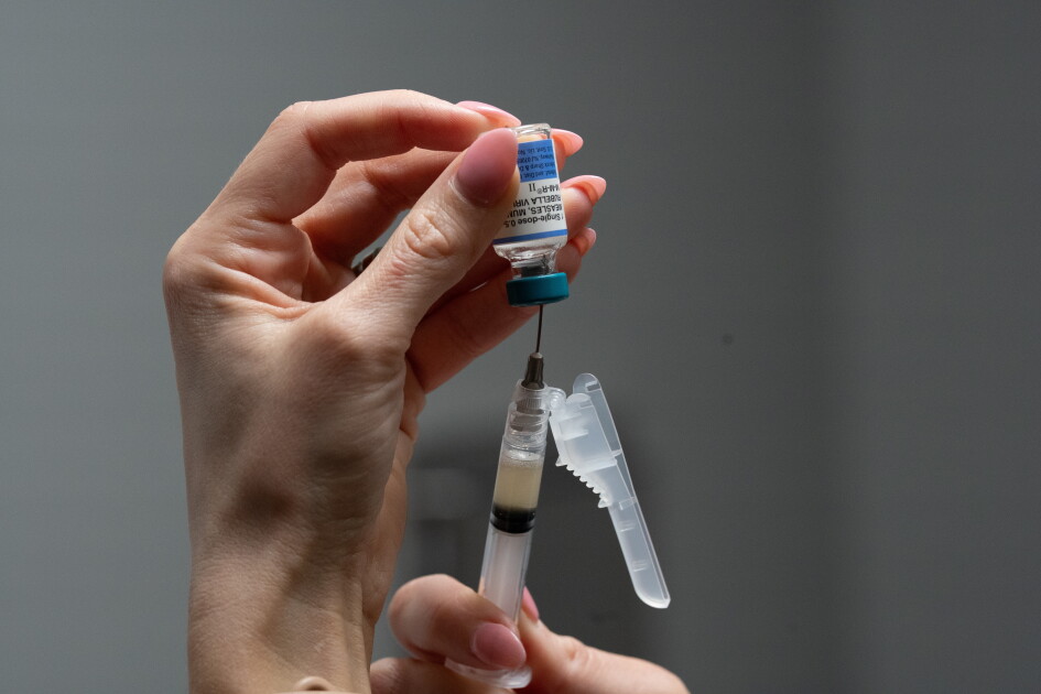 Photo: Education Week A nurse, prepares a combination measles, mumps and rubella vaccine for a patient at a pediatrics clinic in Easley, S.C