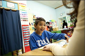 Christian Crank, a kindergartner at Silver Spring Elementary, works with his special education teacher. Were it not for the partnership with Bradley Hospital, Chris would likely be bused elsewhere for school.