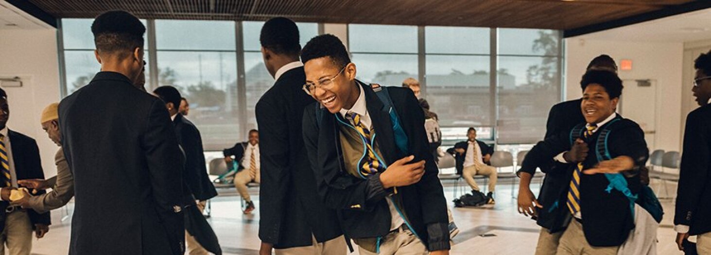 Ron Brown College Preparatory High School students greet each other during the morning circle in Washington. The all-male school is designed specifically to meet the needs of young black men in the nation’s capital.
