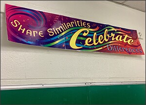 A poster saluting diversity hangs in Christina Mier's classroom.