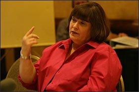 CHRISTINE DOMINGUEZ: The deputy superintendent, shown at a school board meeting, says instruction has remained the focus in the district.