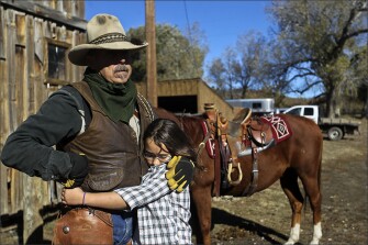 Corinne Gaby hugs her father, Jack, before he leaves to work on the ranch.