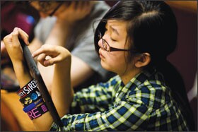 Serena Lee, 14, plays a video game developed by University of Wisconsin-Madison researchers. Video games may be the next frontier of student assessment.
