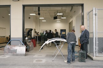 Dean McGee looks at a student’s progress in the automative program at the Journey Career Center on Wednesday, Jan. 11, 2023, in Bakersfield, Calif.