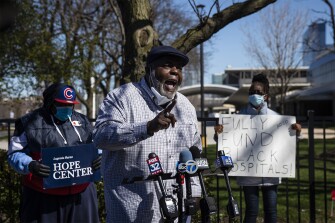 Jitu Brown, national director for the Journey for Justice Alliance, speaks to reporters outside Mercy Hospital & Medical Center in Chicago on April 20, 2020.