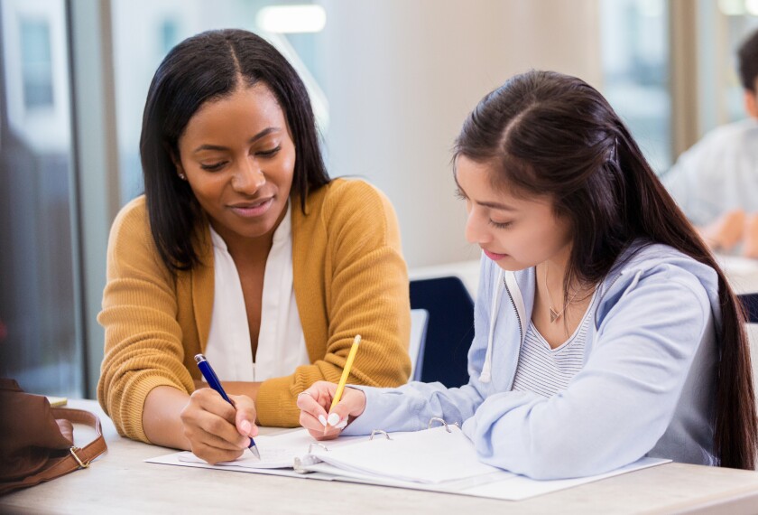 學英文 Professional adult writing and learning English at desk