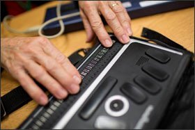 Kate Crohan, Teacher of the Visually Impaired in the Secondary Program at Perkins School for the Blind, uses a BrailleNote Apex Notetaker in her classroom in Watertown, Massachusetts, USA, on Tues., Oct. 15, 2013. The Apex has wifi capabilities and works as a word processor, web browser, calculator, and email device. The Apex device is controlled through the braille keyboard buttons at the top. Emails and other documents are displayed in braille across the bottom row of the device. Crohan's class helps familiarize students with these devices and also general computer literacy. Crohan likes using the Apex devices because it relies so heavily on braille.