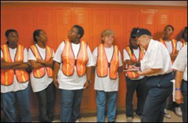 Storm-battered Bonnebel High reopened October 3. Even teachers were pressed into service working to clean waterlogged classrooms, cutting and hauling trees, bleaching walls, and "picking up things that we never, ever thought that we would have to pick up," as history teacher Jo-Ann Ordoyne put it.